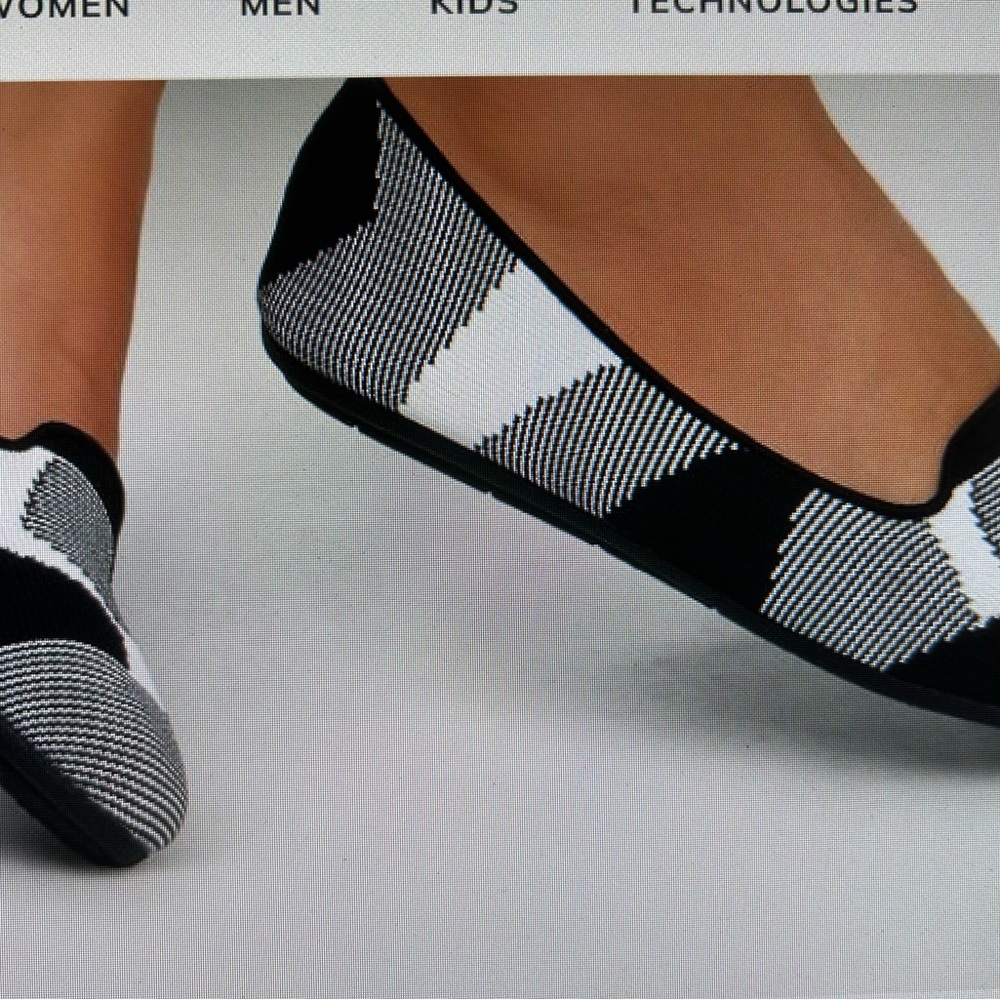 Sketcher black and white slippers. Size is 7.5.